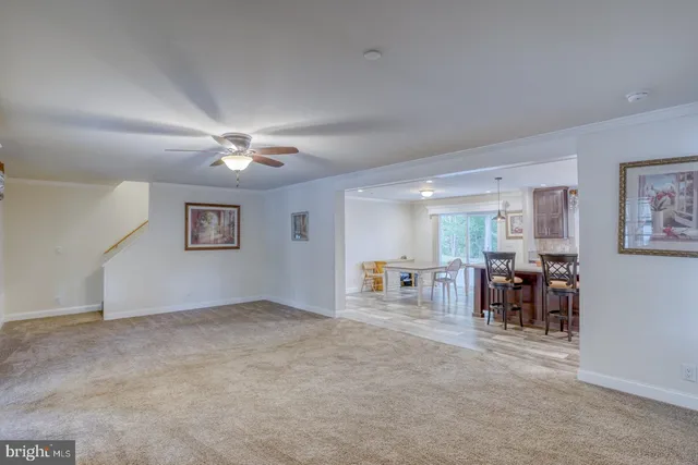 a kitchen with stainless steel appliances granite countertop sink stove refrigerator and cabinets