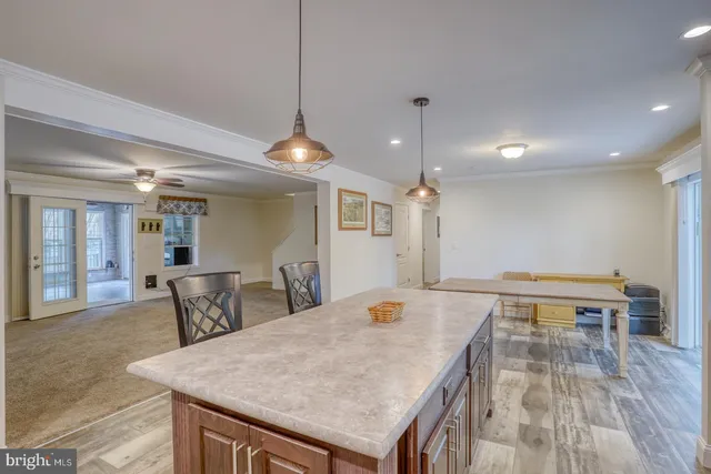 a spacious bathroom with a granite countertop tub and a sink