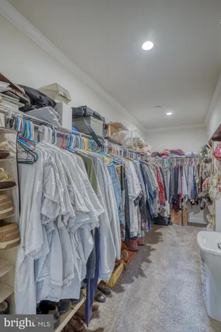 a kitchen with granite countertop a sink stove and cabinets
