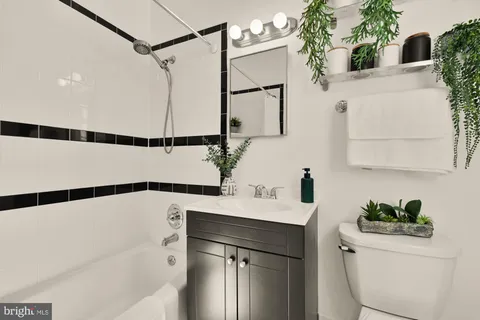a bathroom with a sink and a shower