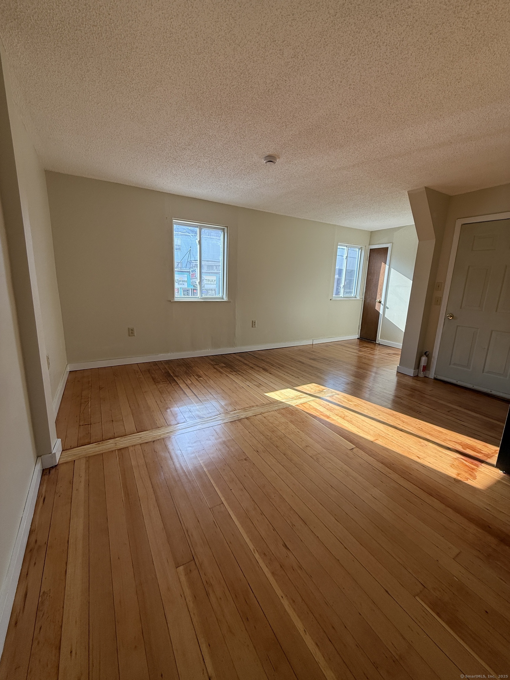 113 East Main Street Thomaston, CT 06787 - Photo 1 of 1 a view of empty room with wooden floor