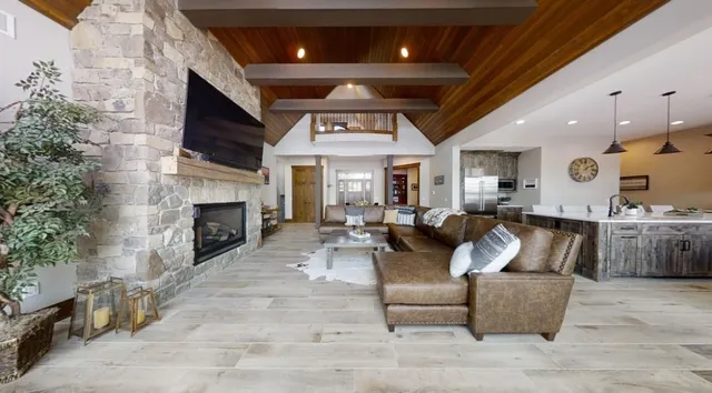a kitchen with stainless steel appliances granite countertop a refrigerator and a stove top oven