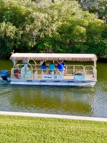 a view of a swimming pool with lounge chairs