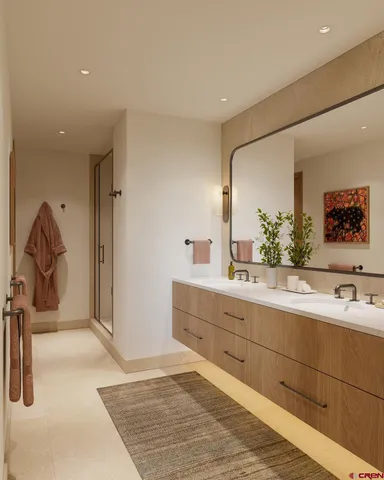 a spacious bathroom with a double vanity sink and a mirror