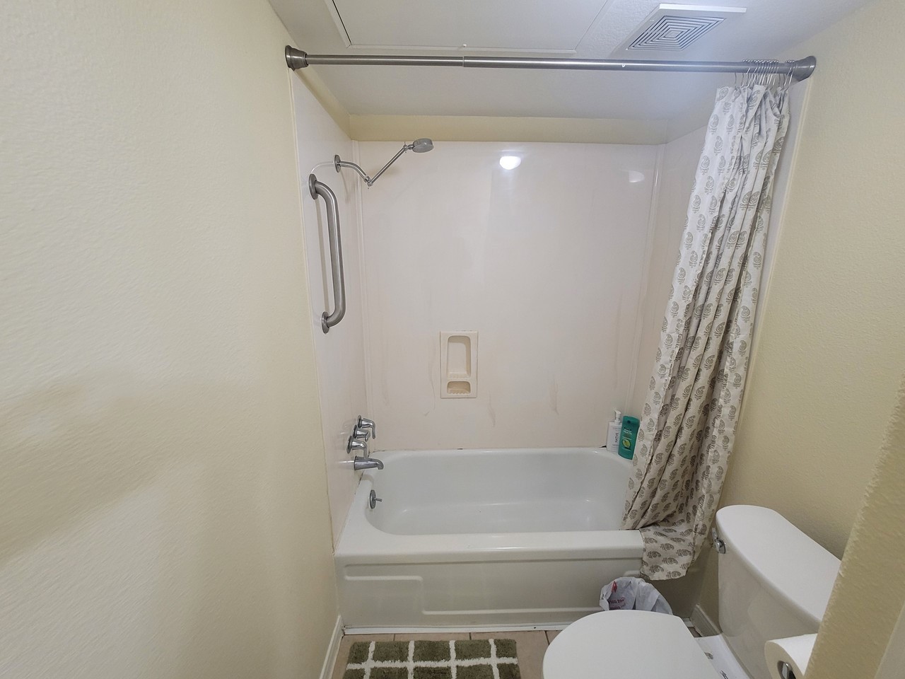215 Postoffice Street, Unit 801 Galveston, TX 77550 - Photo 14 of 16 a bathroom with a shower and a toilet