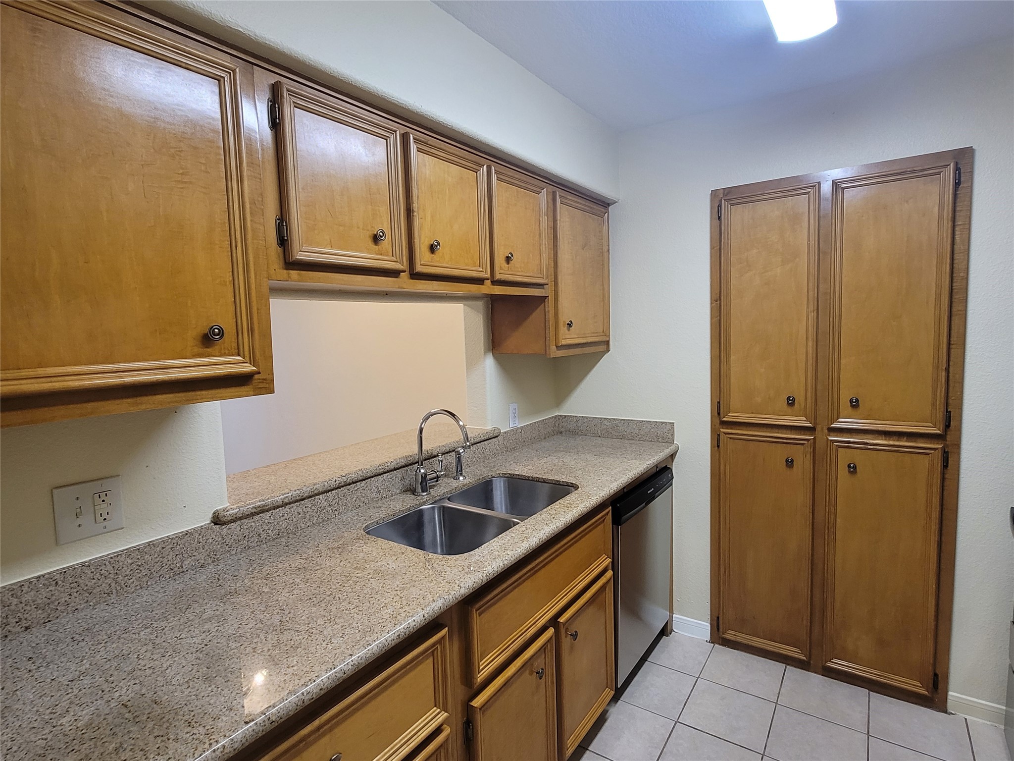 215 Postoffice Street, Unit 801 Galveston, TX 77550 - Photo 7 of 16 a kitchen with a sink and cabinets