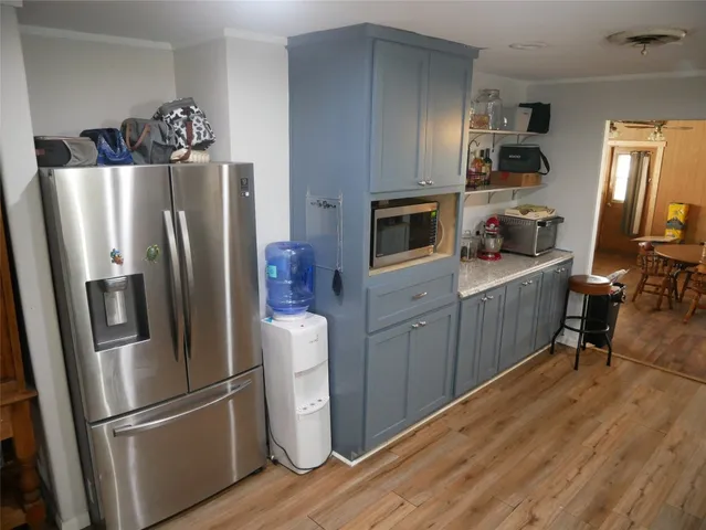 a bedroom with a bed couch and window