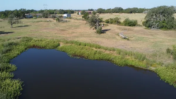 a view of lake with green space