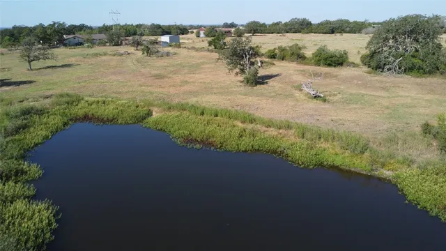 a view of lake with green space