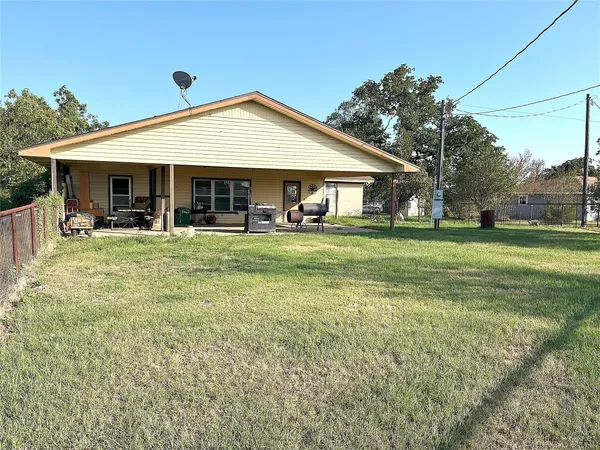 a front view of a house with a yard and porch