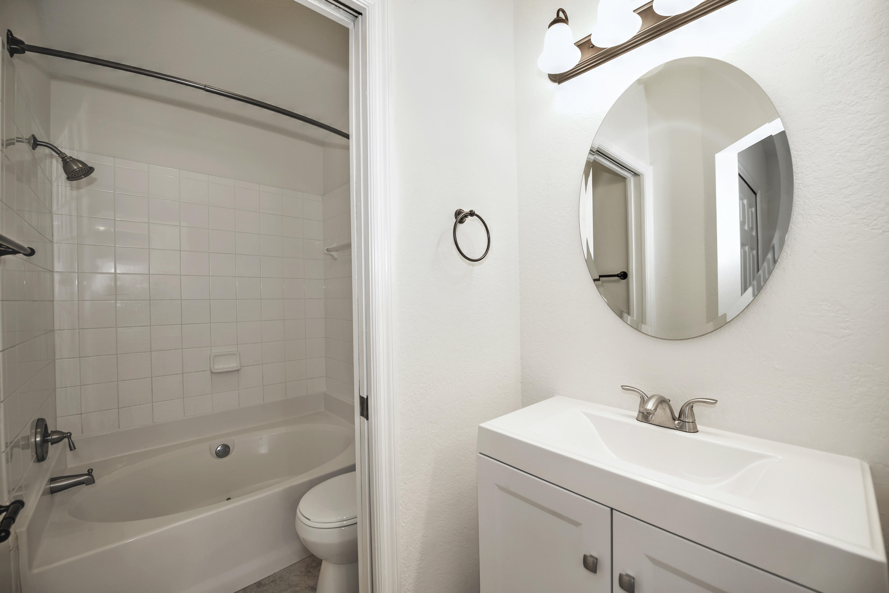 271 18th Street Southeast Naples, FL 34117 - Photo 12 of 28 a bathroom with a sink a toilet and a mirror