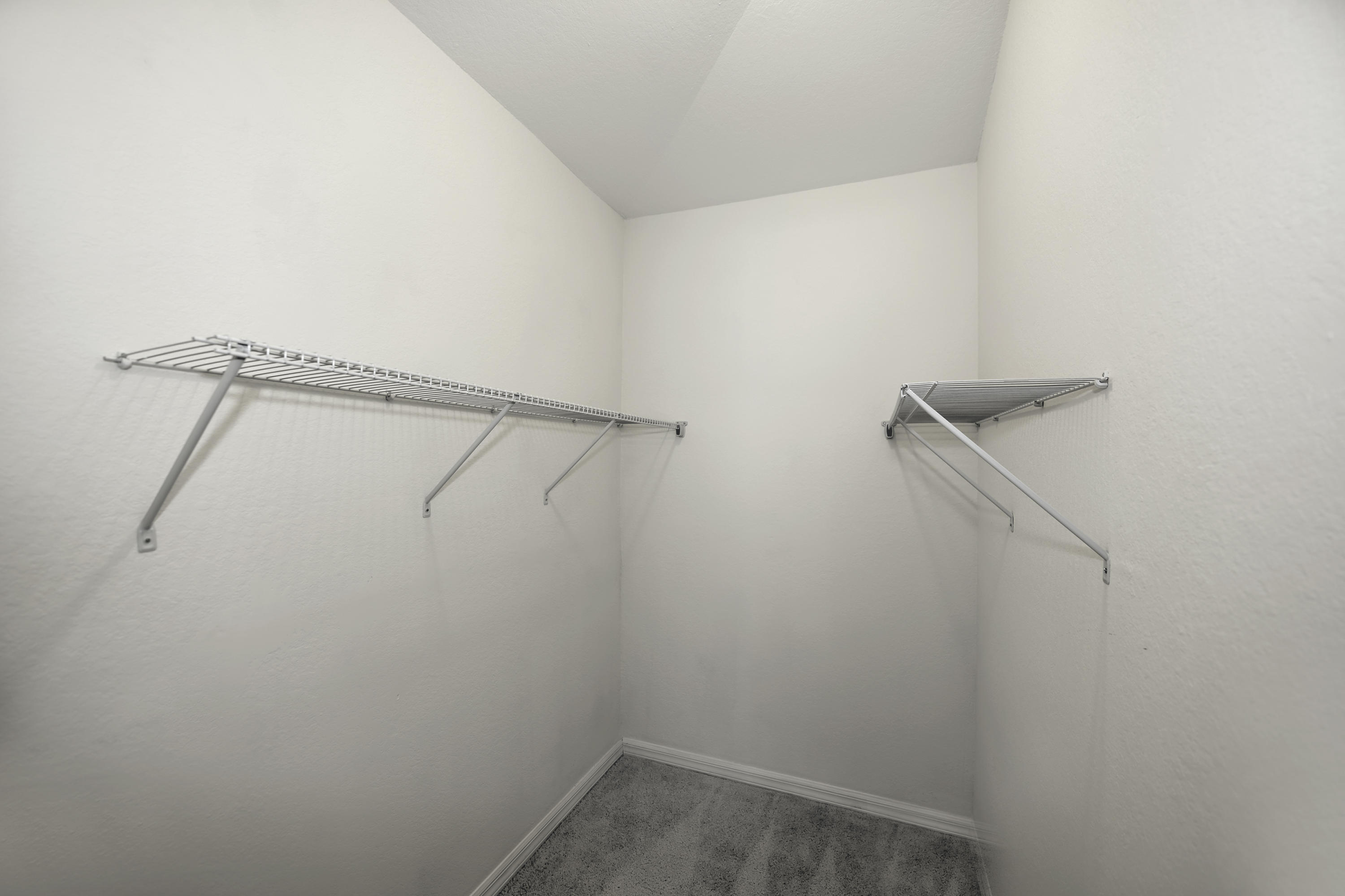 271 18th Street Southeast Naples, FL 34117 - Photo 14 of 28 a view of small space with racks on the wall