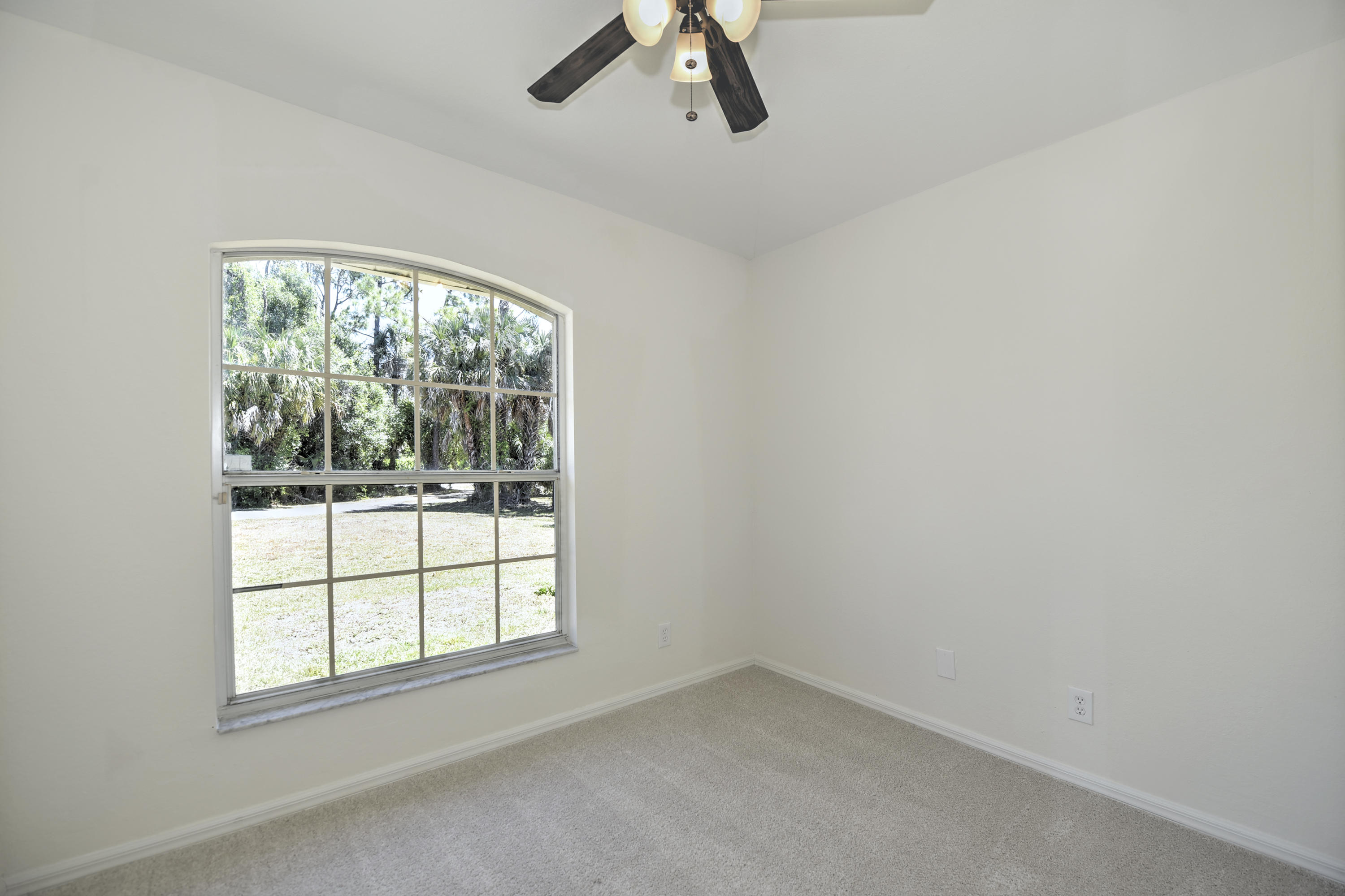 271 18th Street Southeast Naples, FL 34117 - Photo 16 of 28 an empty room with a window