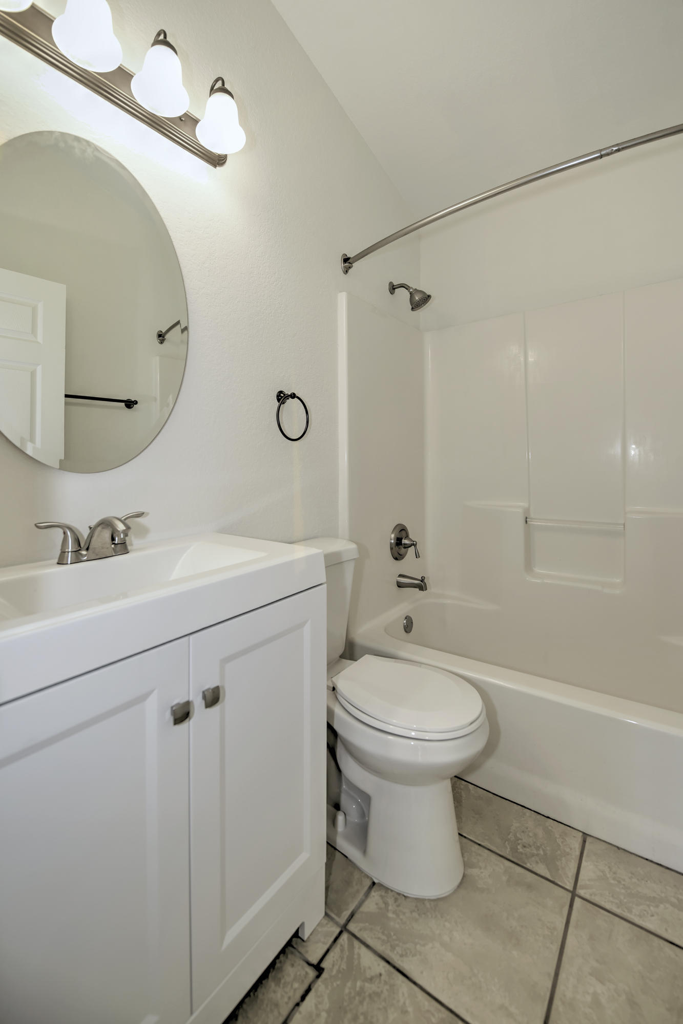 271 18th Street Southeast Naples, FL 34117 - Photo 19 of 28 a bathroom with a sink toilet and a mirror