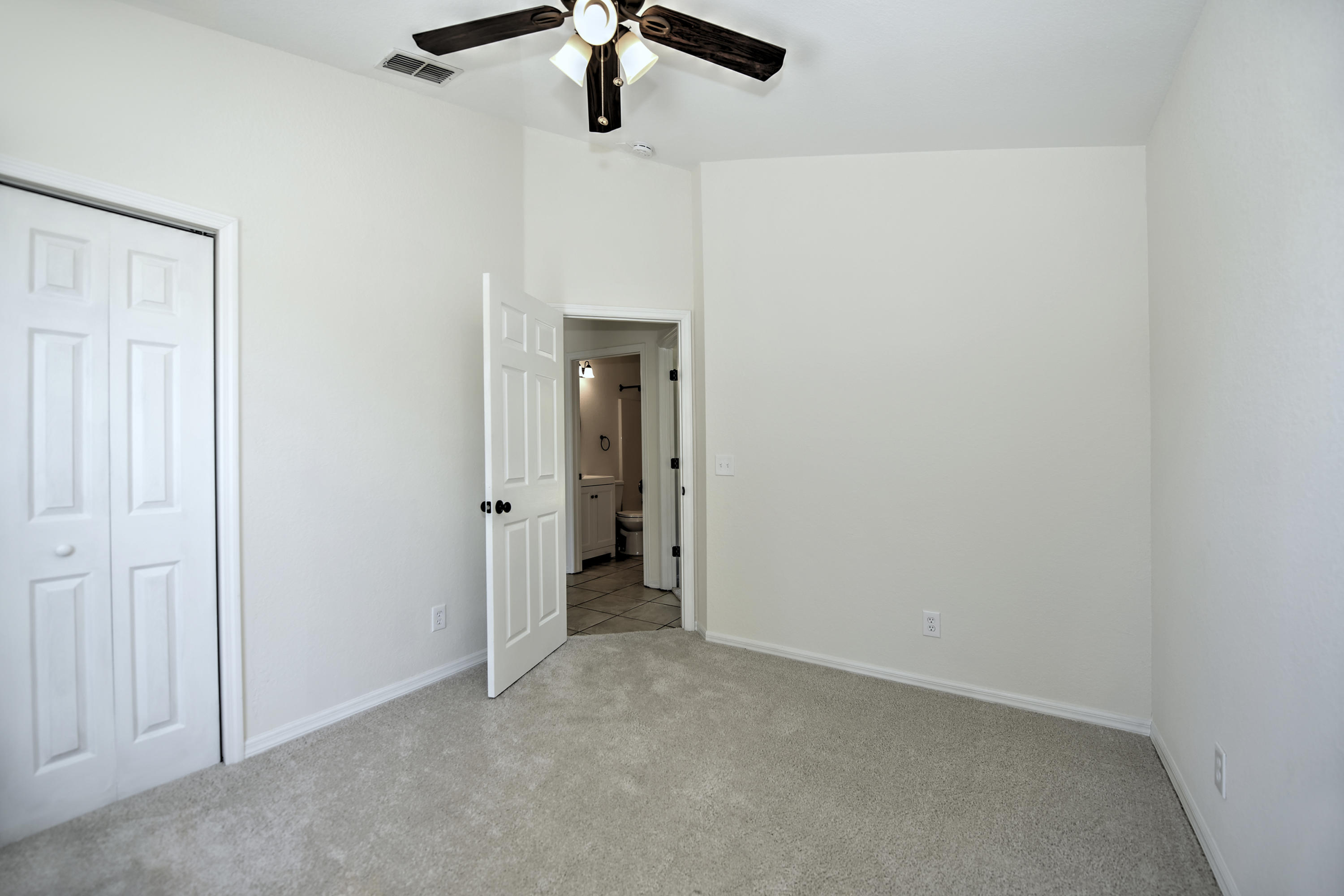 271 18th Street Southeast Naples, FL 34117 - Photo 20 of 28 an empty room with a ceiling fan