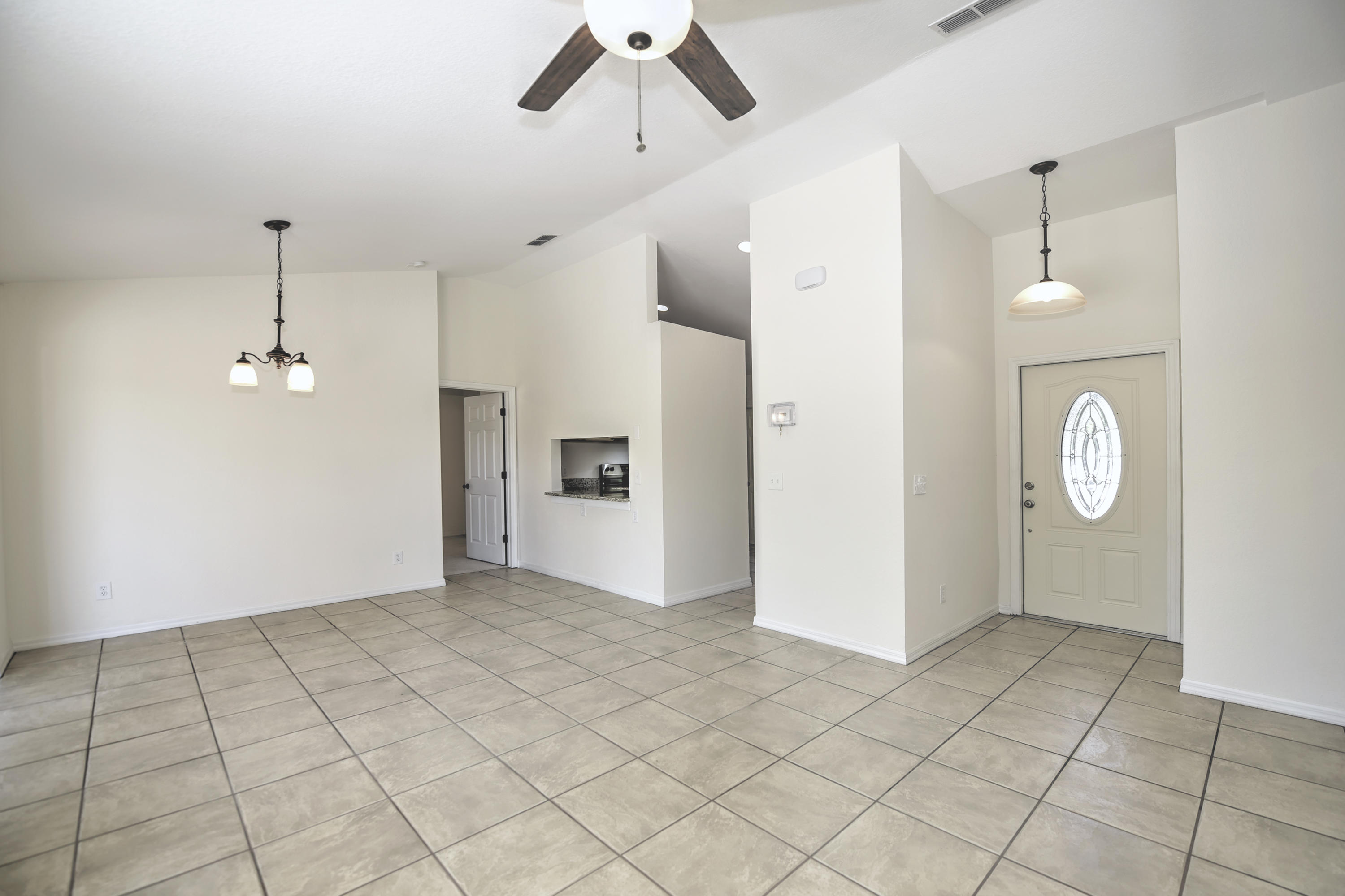 271 18th Street Southeast Naples, FL 34117 - Photo 3 of 28 a view of an empty room and window