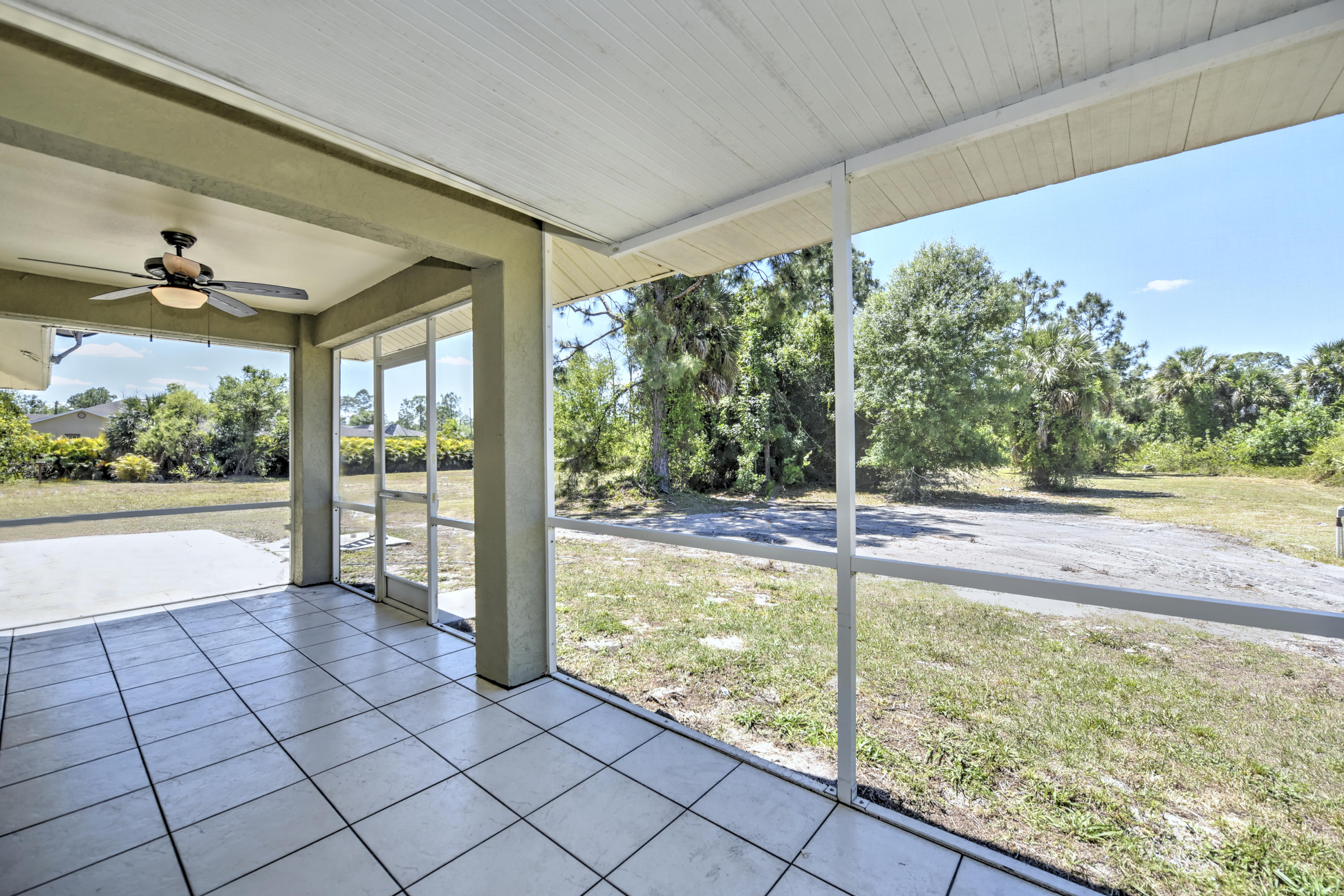 271 18th Street Southeast Naples, FL 34117 - Photo 23 of 28 a view of a living room and floor to ceiling window