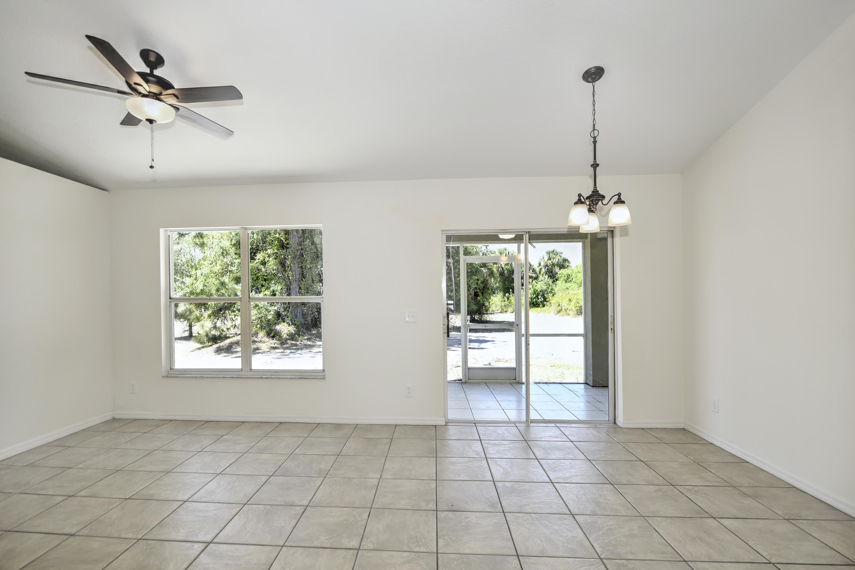 271 18th Street Southeast Naples, FL 34117 - Photo 4 of 28 a view of an empty room and window