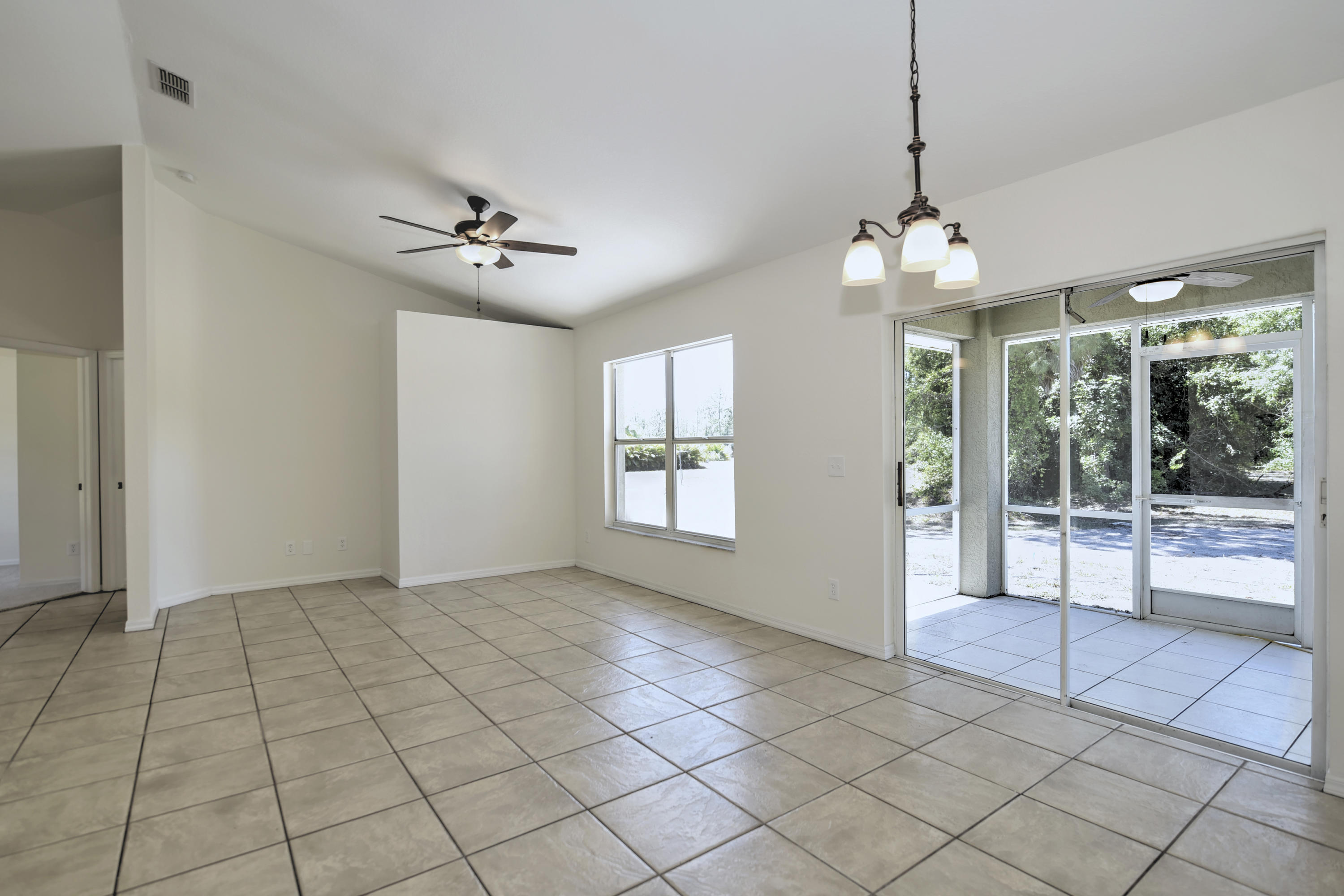 271 18th Street Southeast Naples, FL 34117 - Photo 5 of 28 a view of an empty room with a window