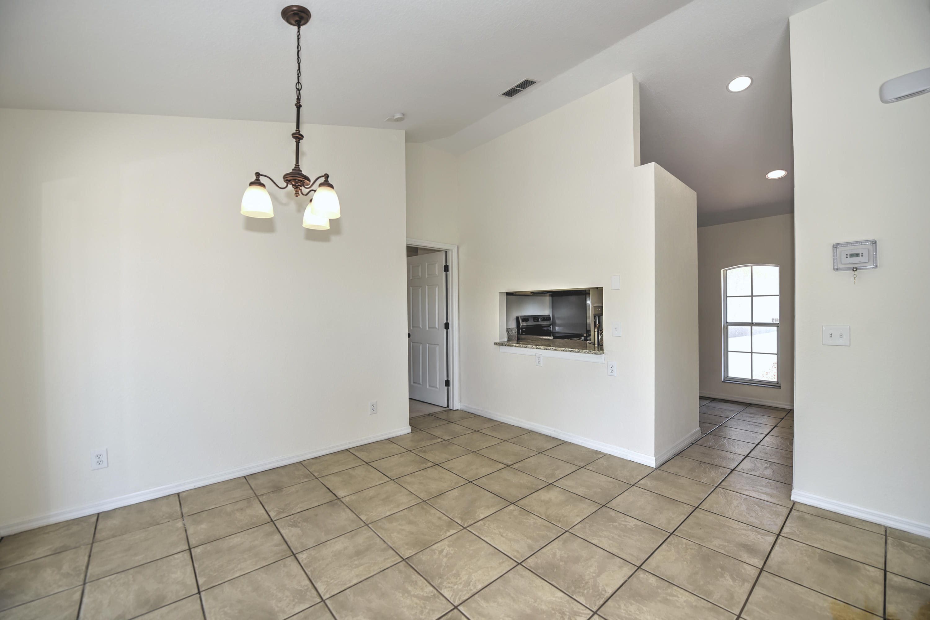 271 18th Street Southeast Naples, FL 34117 - Photo 7 of 28 a view of livingroom with chandelier