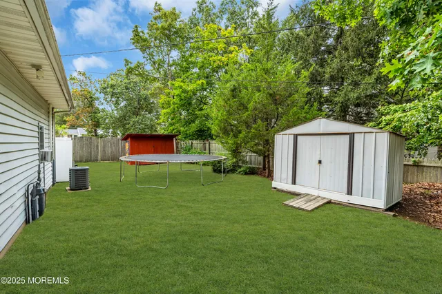 a front view of house with a garden