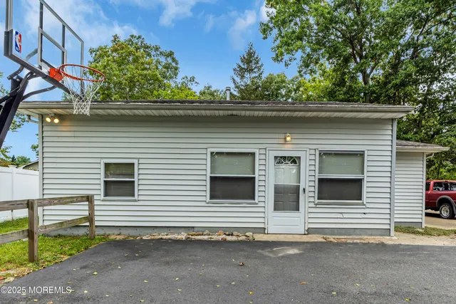 a house that has a tree in front of the house