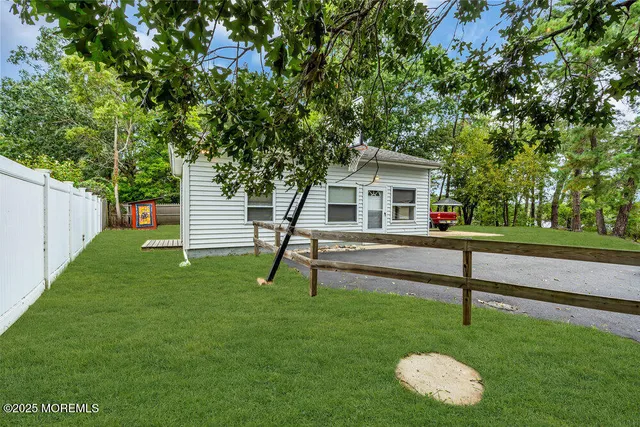 a house view with a sitting space and garden