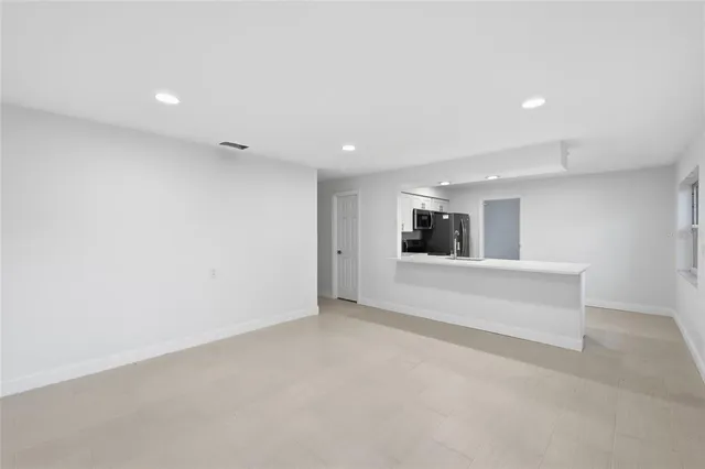 an empty room with large window