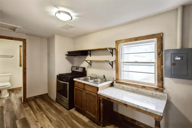 a kitchen with a stove and a sink