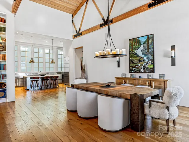 a dining hall with furniture and wooden floor