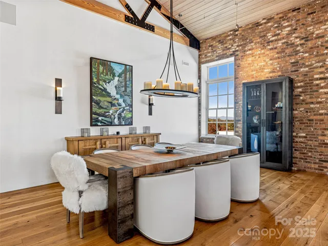 a dining table with chairs and wooden floor