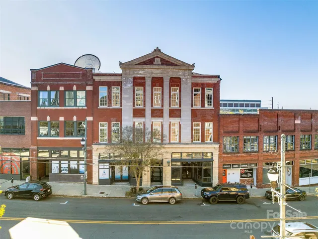 a front view of a building with street view