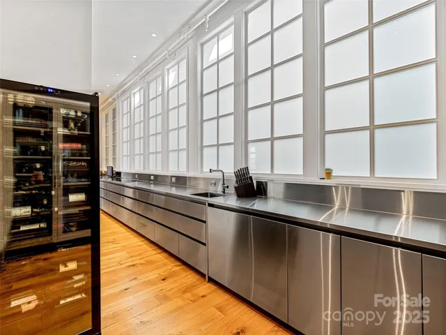 a kitchen with stainless steel appliances a sink and a counter
