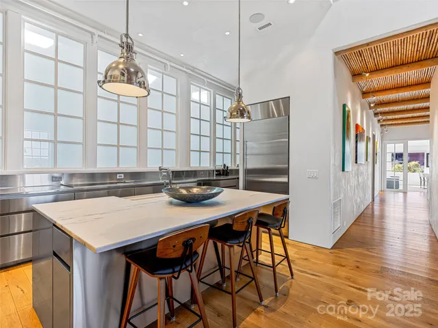 a view of a dining table and chairs