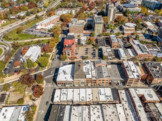 a view of parking garage with cars parked