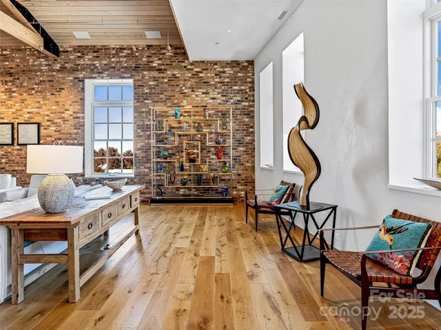 a view of a livingroom with furniture and window