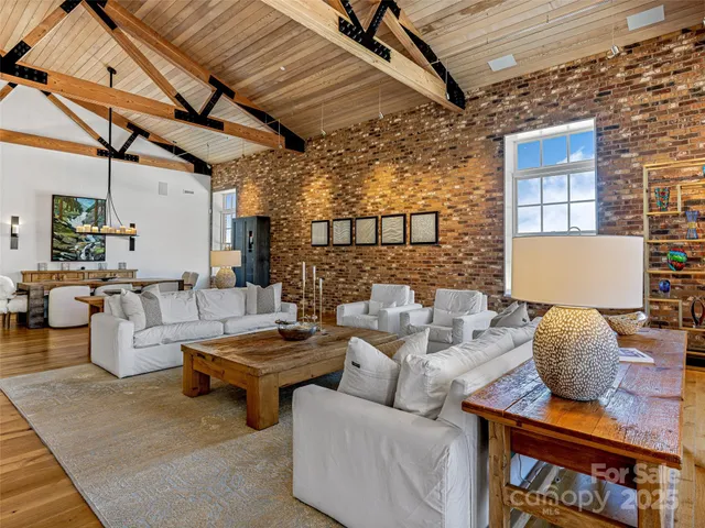 a living room with furniture and a table