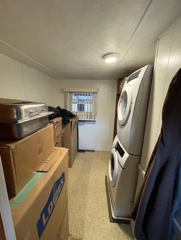 a view of a storage and utility room with washer and dryer