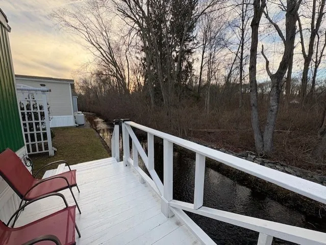 a view of a chairs and table in the balcony