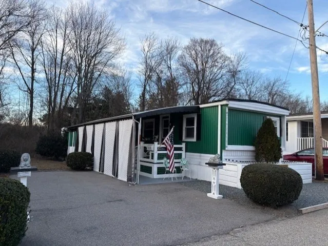 a view of a patio with a table and chairs