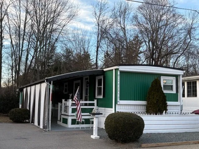 a view of a car park in front of house