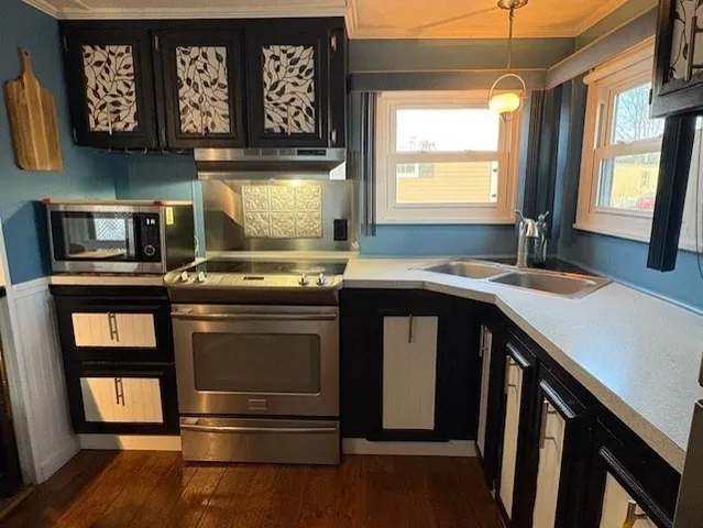 a kitchen with a stove and a sink