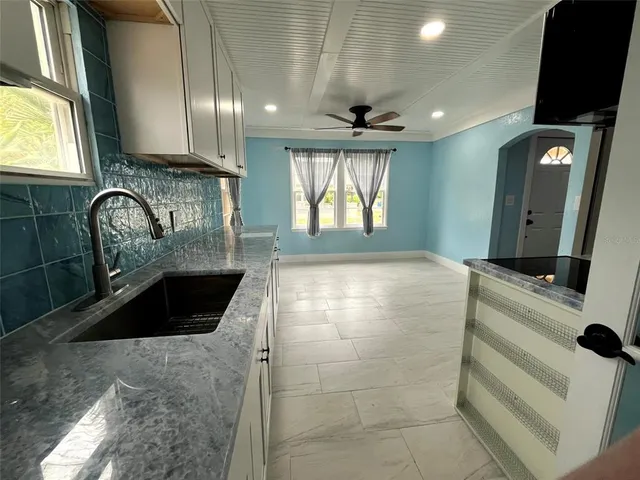 a large bathroom with a sink and a large mirror