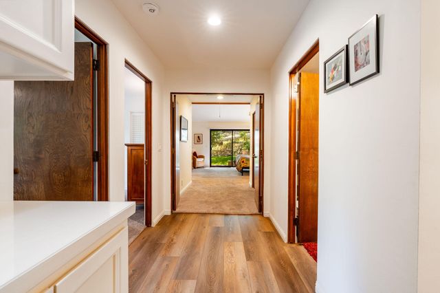 a kitchen with stainless steel appliances granite countertop a stove and a refrigerator