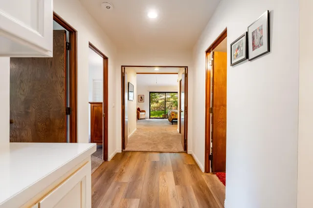 a kitchen with stainless steel appliances granite countertop a stove and a refrigerator