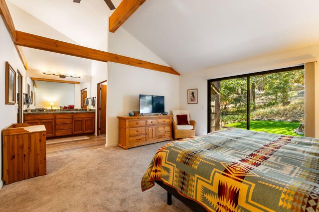 a view of a chairs and table in the wooden deck