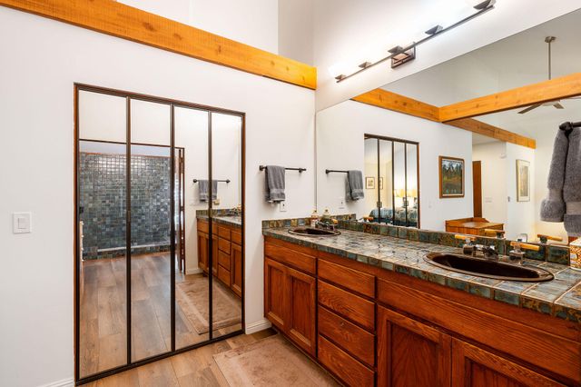 a room with gym equipment and wooden floor