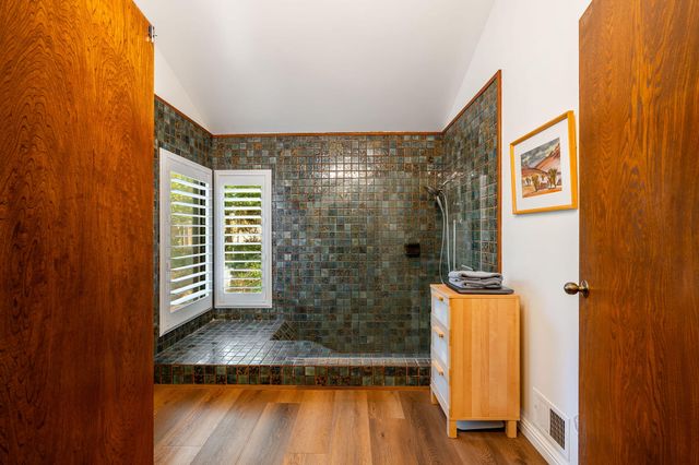 a living room with furniture and a chair