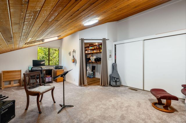 a wooden bench sitting in front of a building