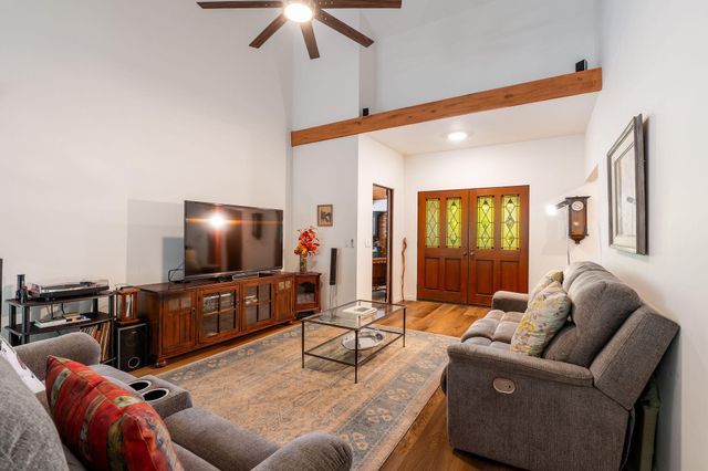 a kitchen with stainless steel appliances granite countertop sink stove and large window